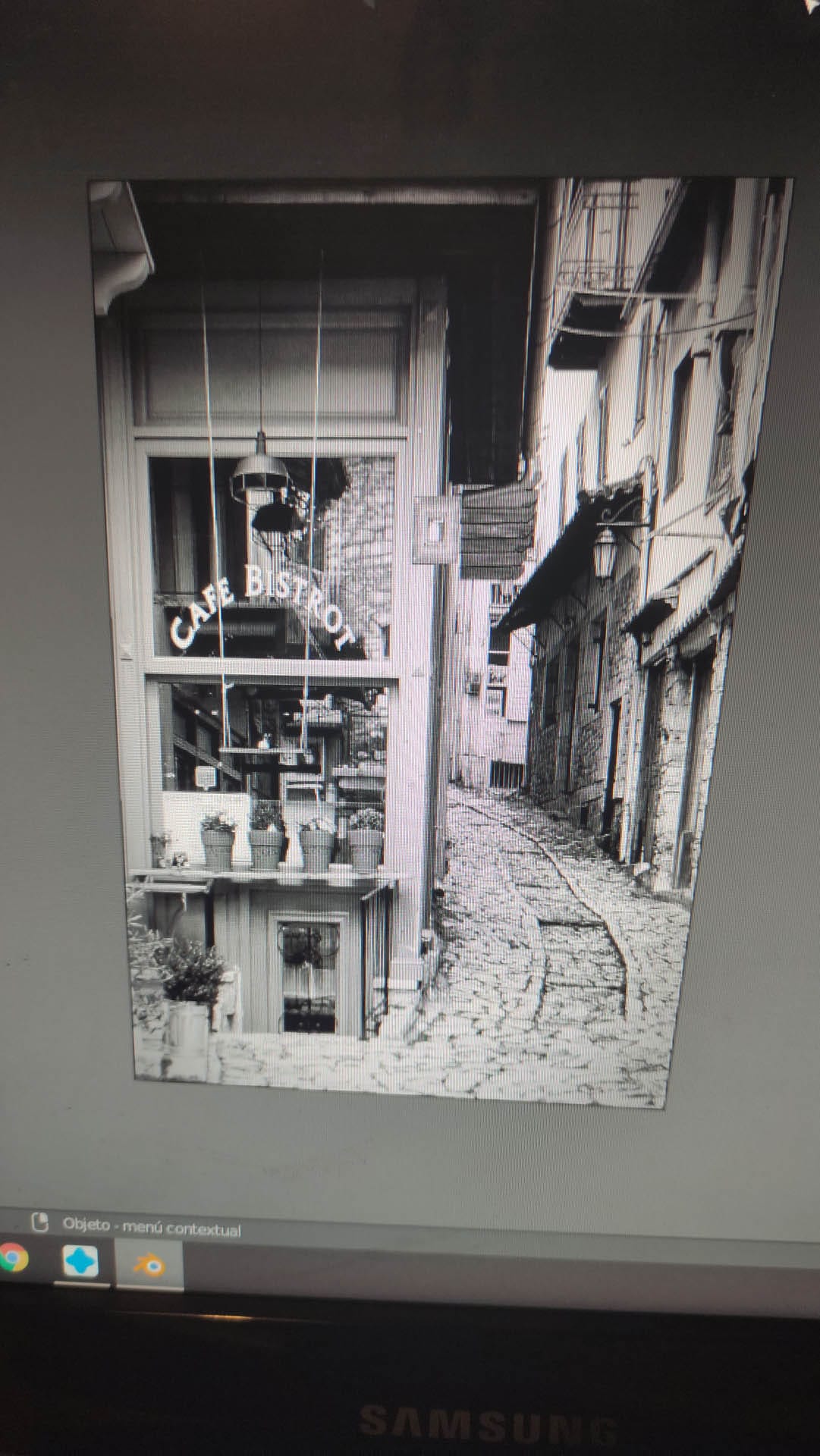 Diorama de una calle de París con fachadas de ladrillo, iluminación LED cálida y perspectiva forzada.