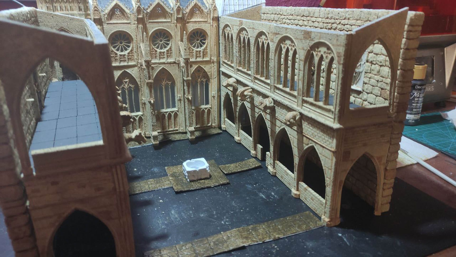 Diorama detallado de una abadía medieval de 27 Dioramas, mostrando arquitectura gótica en miniatura y texturas realistas