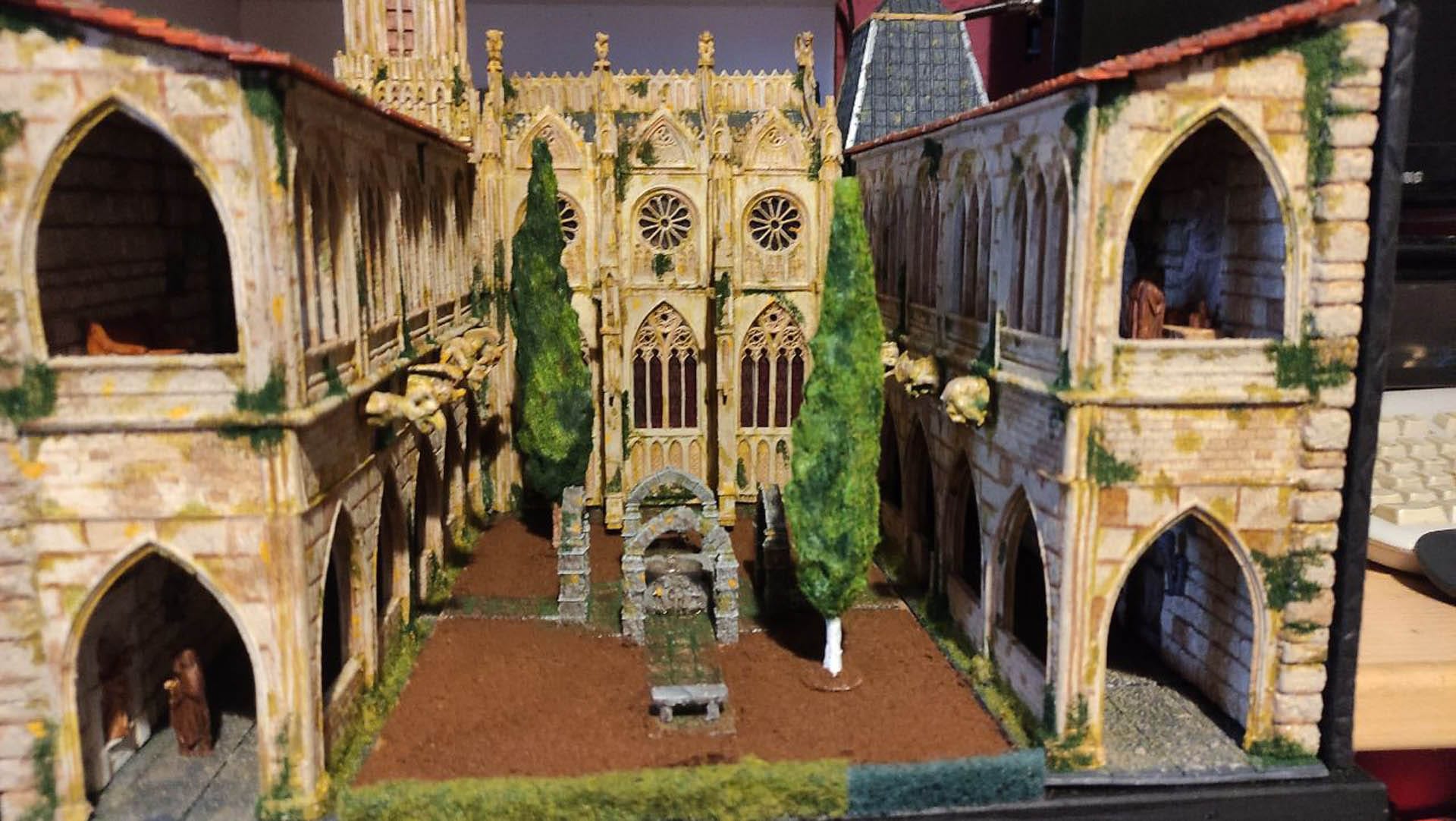 Diorama detallado de una abadía medieval de 27 Dioramas, mostrando arquitectura gótica en miniatura y texturas realistas